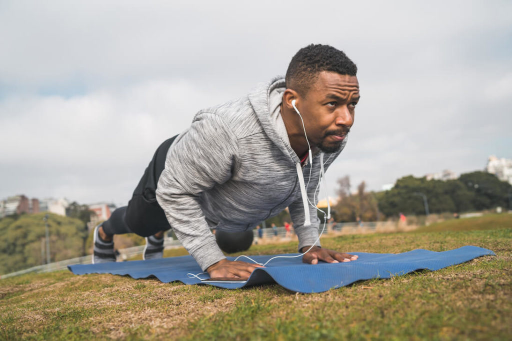 men's sports over 40 - pushups training exercise at park