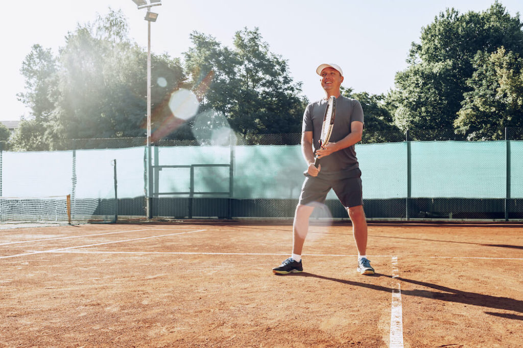 men's sports over 40 - tennis training exercise with friend