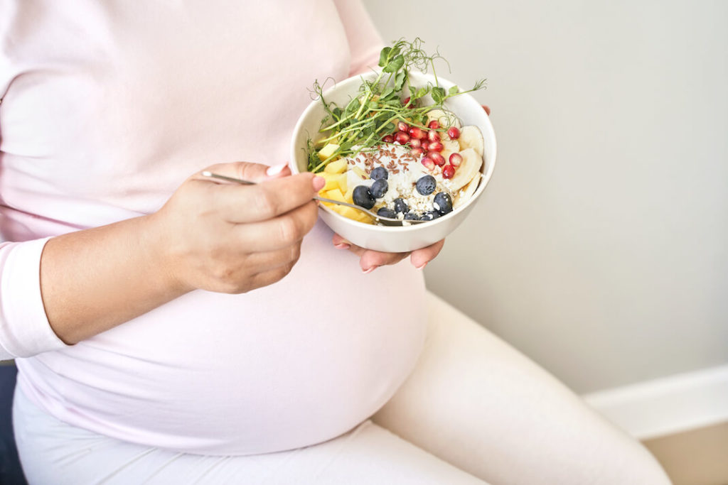 Constipation Treatment During Pregnancy - Pregnant Woman Eating Fiber Rich Food