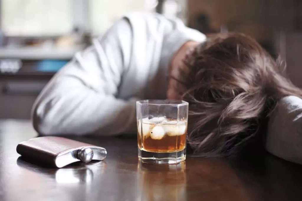 Why Alcohol is Addictive - Alcoholic Addictive Man Passed Out on Table