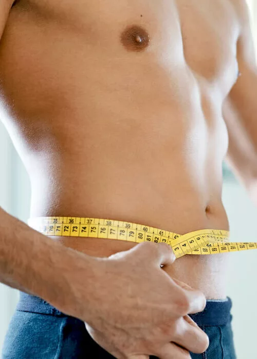 Free Body Fat Calculator - Fit male measuring his body fat