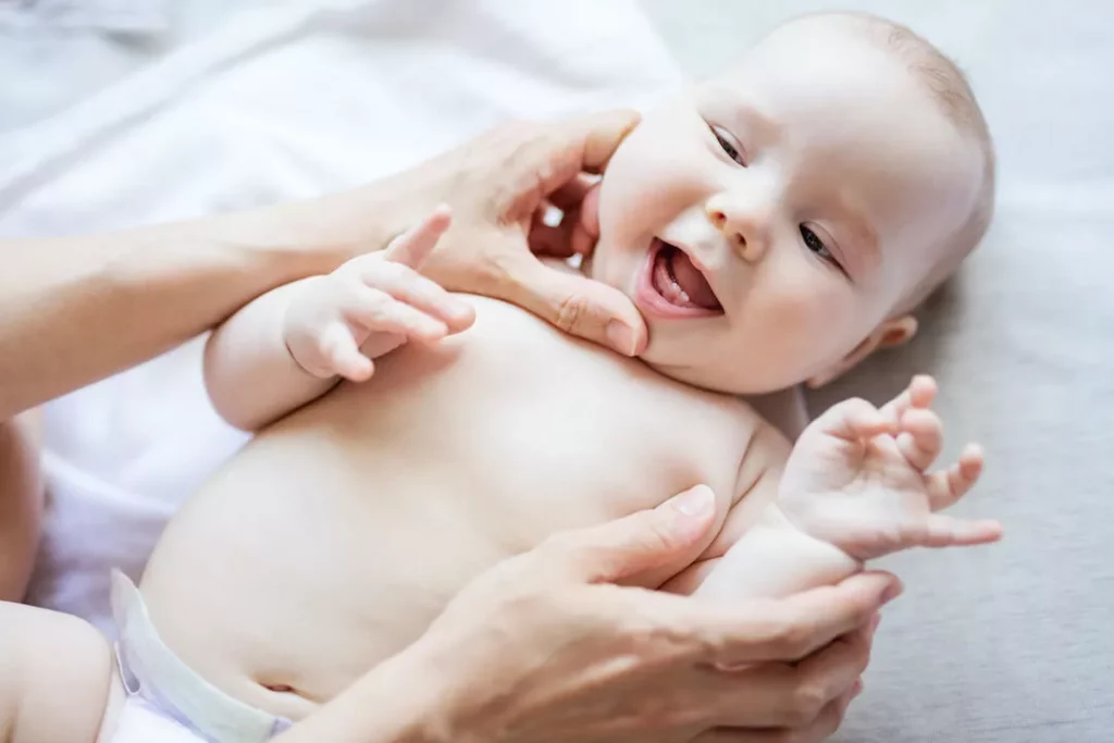 Why My Baby's Teeth Coming in Wrong Order - Mother checking her baby's teeth